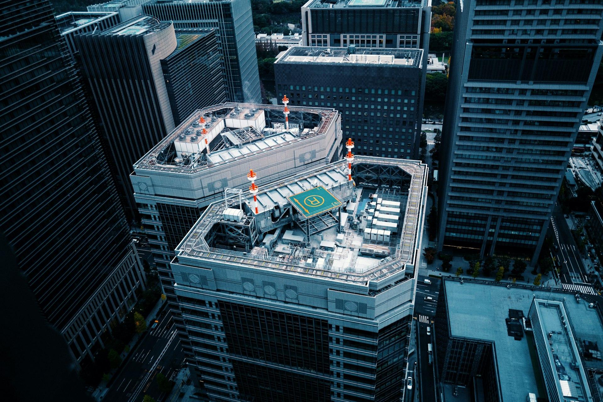 Rooftop helipad on a high-rise in a dense city
