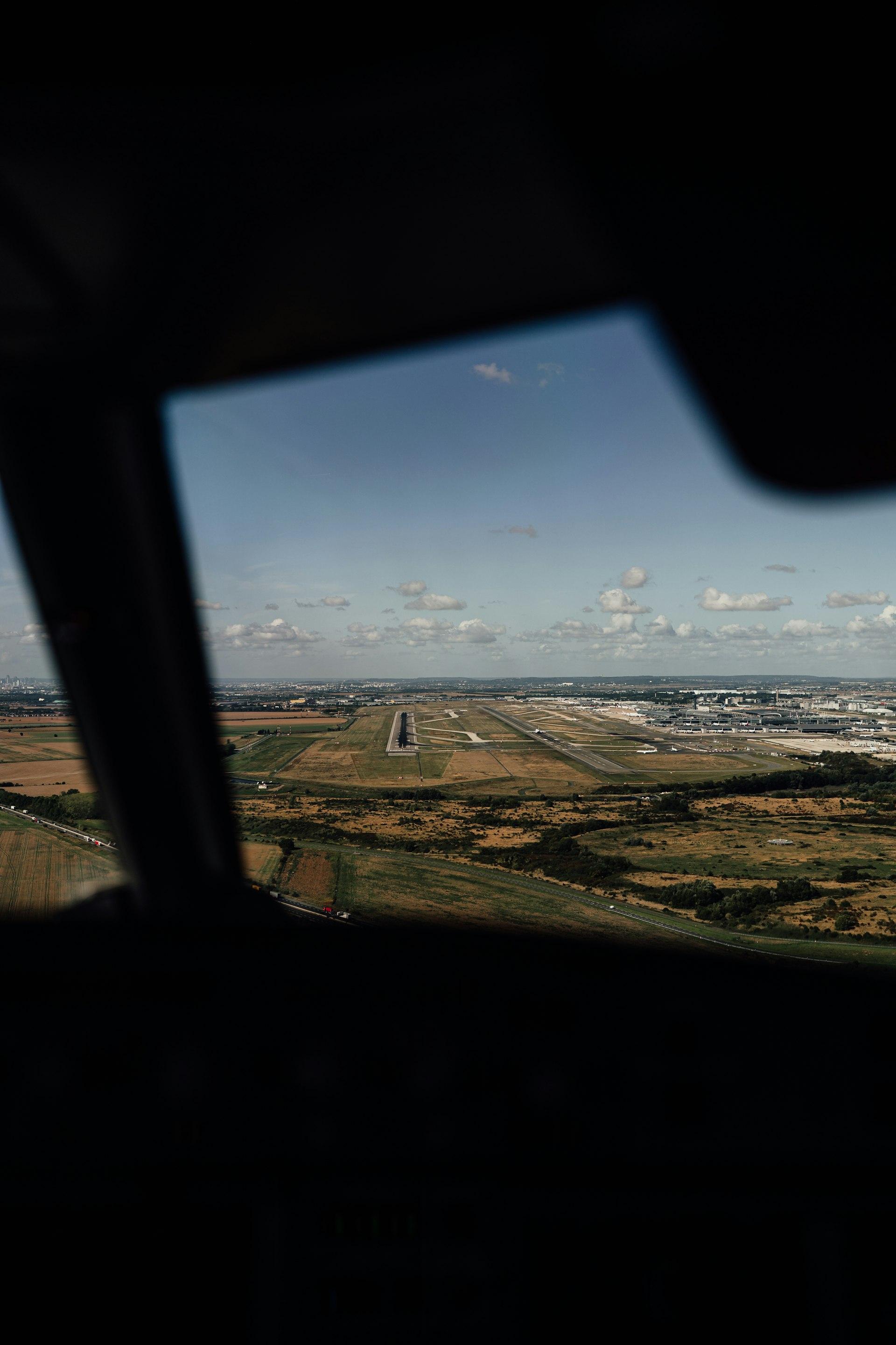 Runway seen from an aircraft cockpit on approach