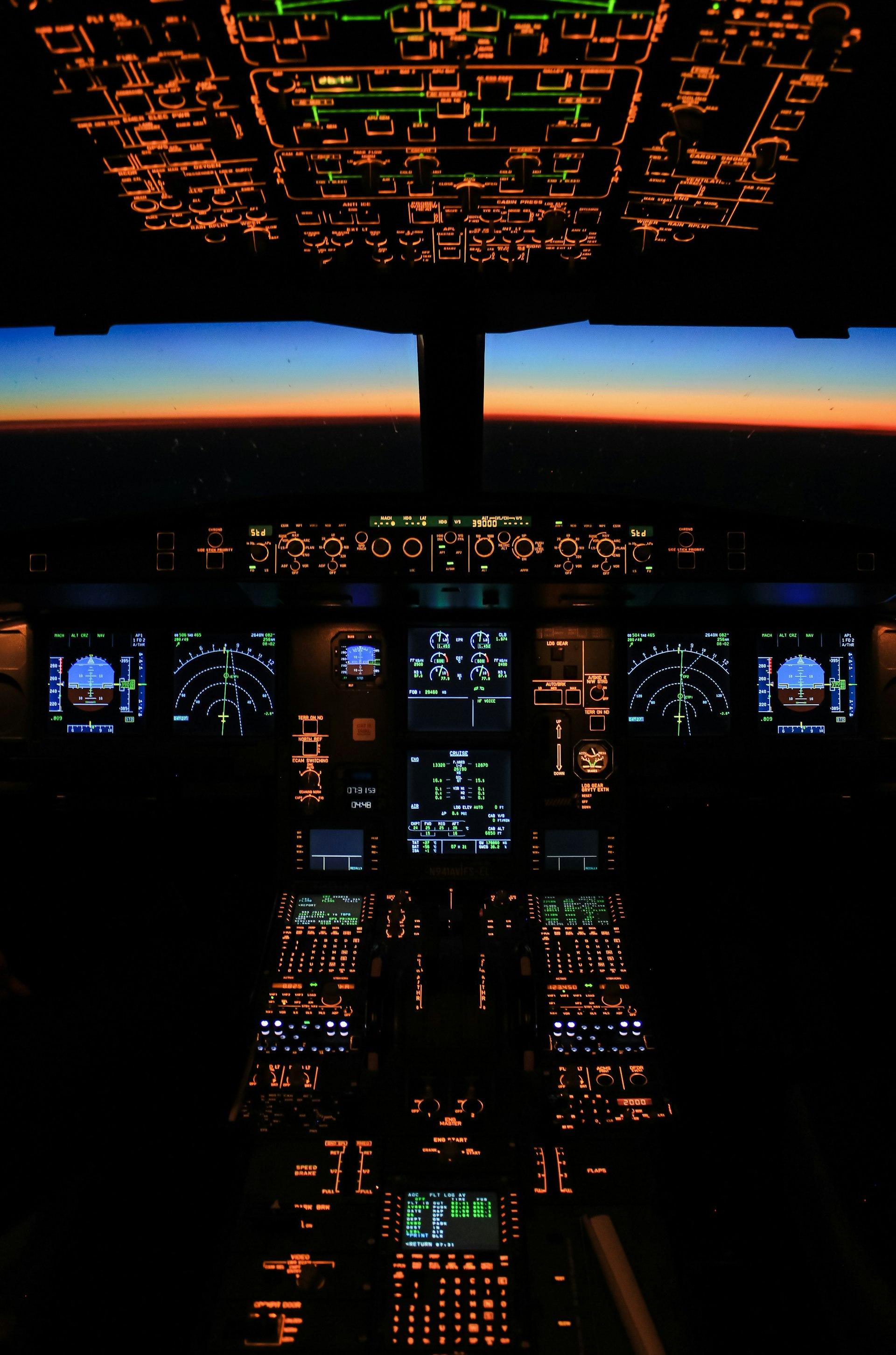 Illuminated aircraft cockpit at night