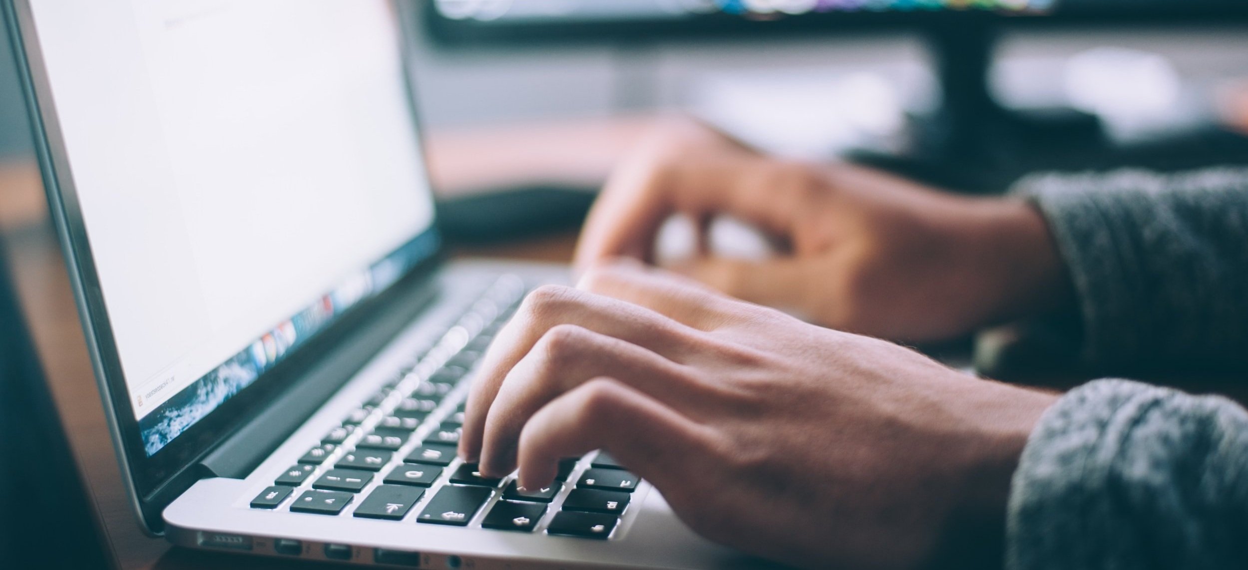 decorative image image of person typing on keyboard